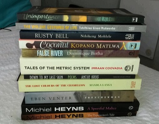 A selection of new titles (there are more,  confess). Trencherman, the Michiel Heyns, Tales of Metric System, Rusty Bell and The Violent Gestures of Life were all on top of my list when I arrived.